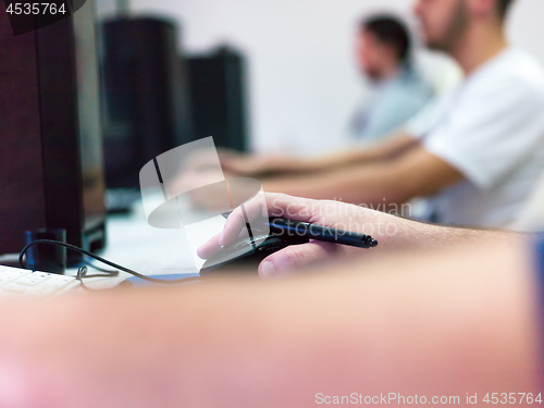 Image of Closeup of Graphic Designer Working at Workplace