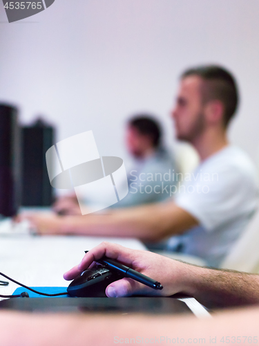 Image of Closeup of Graphic Designer Working at Workplace