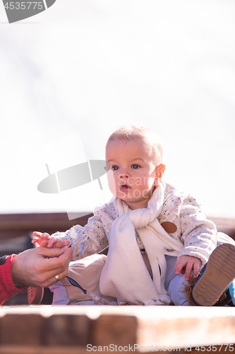 Image of portrait of little baby boy on beautiful winter day