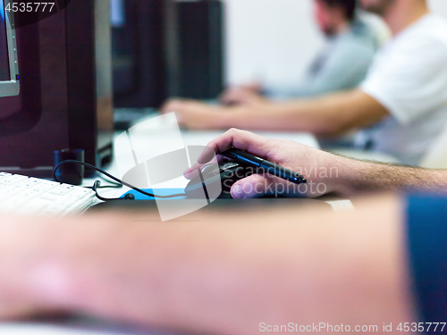 Image of Closeup of Graphic Designer Working at Workplace