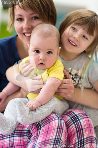 Image of portrait of young mother with  her kids