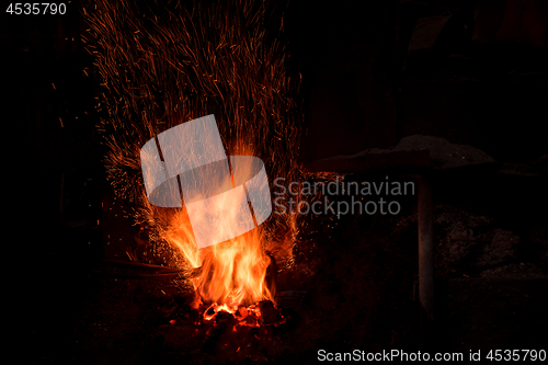 Image of Traditional blacksmith furnace with burning fire