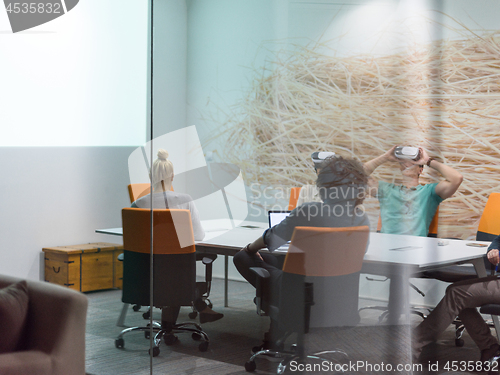 Image of startup business team using virtual reality headset