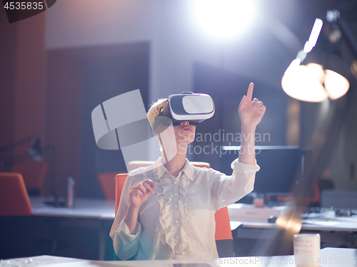 Image of businesswoman using VR-headset glasses of virtual reality