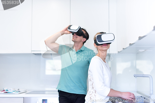 Image of young couple using VR-headset glasses of virtual reality