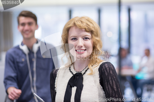 Image of Business People Working With Tablet in startup office