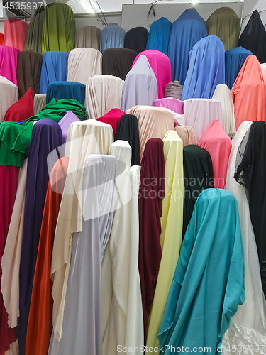 Image of Stock of fabrics roll for sale in market