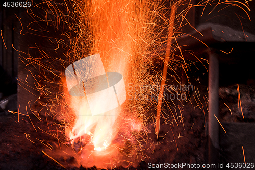 Image of Traditional blacksmith furnace with burning fire