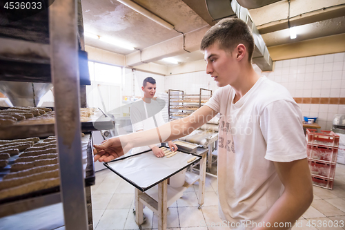 Image of bakers preparing the dough