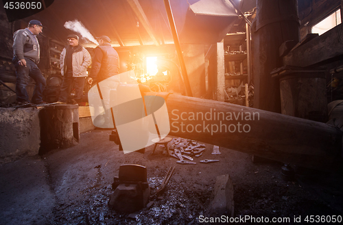 Image of Old mechanical hammer in blacksmith traditional workshop