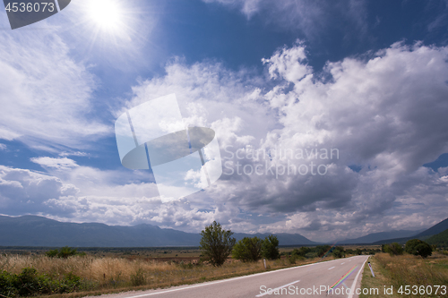 Image of asphalt road in beautiful countryside