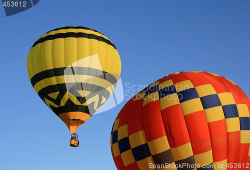 Image of Yellow and red hot air balloons