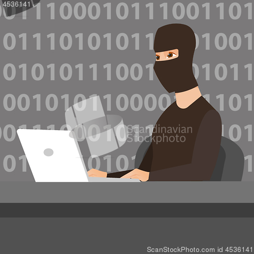 Image of Hacker using laptop to steal information.