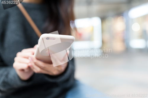 Image of Woman working on smart phone