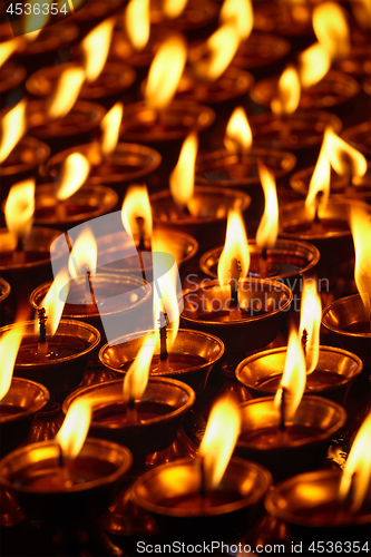 Image of Burning candles in Buddhist temple. Dharamsala, Himachal Pradesh