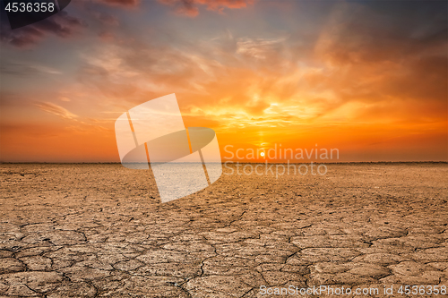 Image of Cracked earth soil sunset landscape