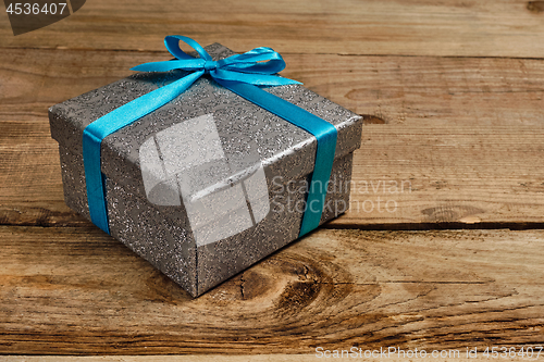 Image of Gift box with blue ribbon