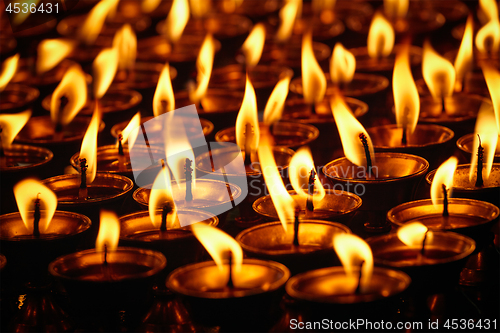 Image of Burning candles in Buddhist temple. Dharamsala, Himachal Pradesh