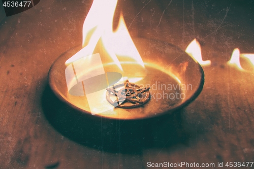 Image of Old pentagram burning in flames