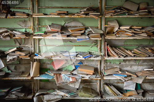 Image of Abandoned bookstore with shelves full of worn books
