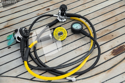 Image of Diving regulators and mouthpiece on boat deck