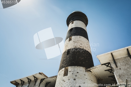 Image of Tall lighthouse on the sea