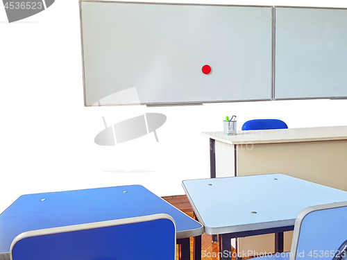 Image of Teachers desk and white board in classroom