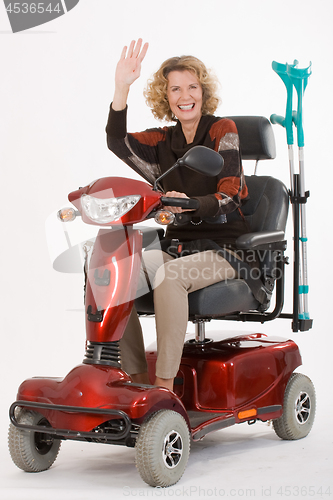 Image of Disabled elderly woman beckons