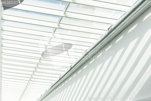 Image of Geometric shapes and patterns in contemporary architecture. Shadow on the white wall.