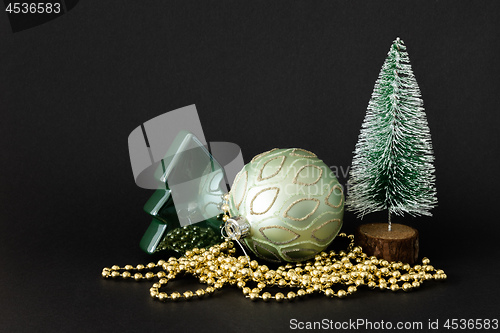 Image of Christmas decoration glass ball with fir trees