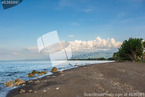 Image of a dark sand beach in northern Bali Indonesia