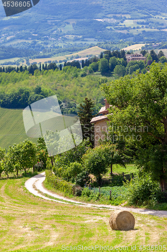 Image of Scenery in Marche Italy with straw bale on a field 