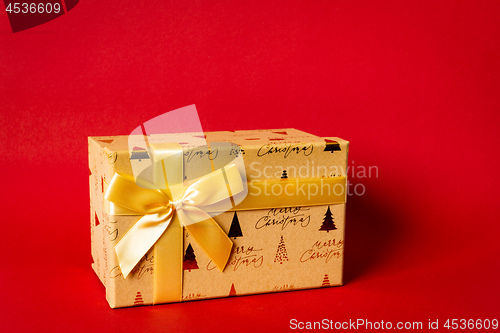 Image of Christmas gift box on red background