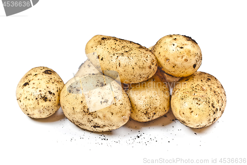 Image of Newly harvested dirty potatoes heap isolated on white background