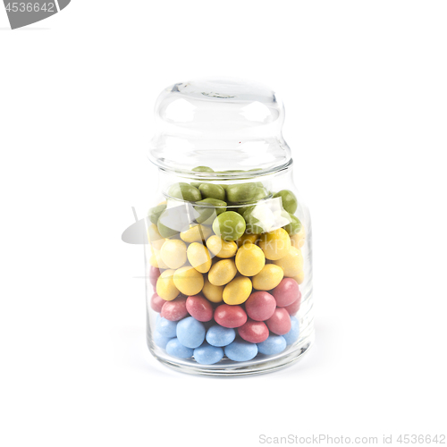 Image of Colorful sweet candies in glass jar isolated on white.