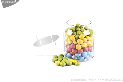 Image of Colorful sweet candies in glass jar isolated on white.