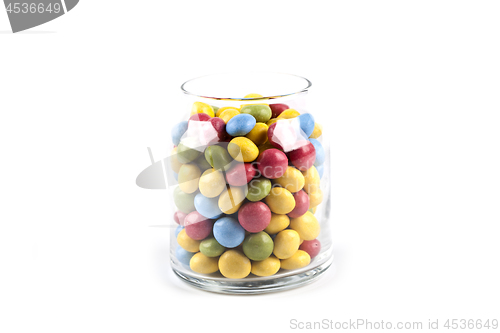 Image of Colorful sweet candies in glass jar isolated on white.