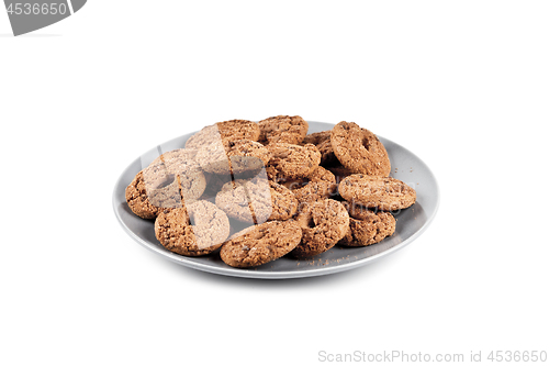 Image of Fresh baked chocolate chip cookies heap on grey plate isolated o