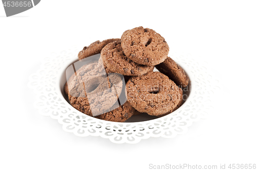Image of Fresh baked chocolate chip cookies heap on white plate isolated 