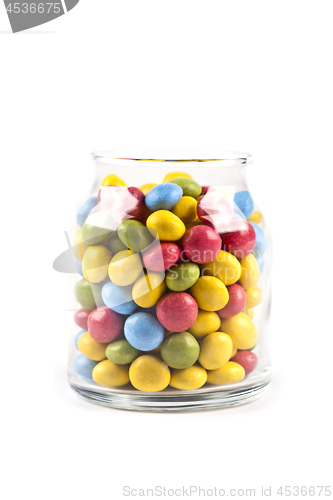 Image of Colorful sweet candies in glass jar isolated on white.