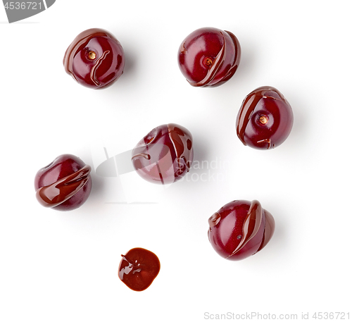 Image of sour cherries covered with melted chocolate