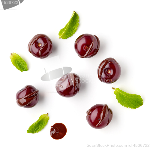 Image of sour cherries covered with melted chocolate