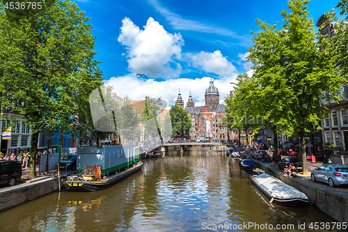 Image of Canal and St. Nicolas Church in Amsterdam