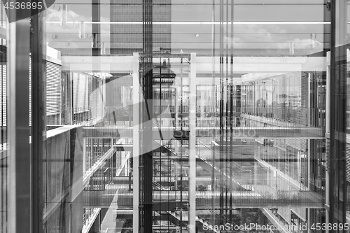 Image of Abstract window reflections in morden office building. Black and white photo.