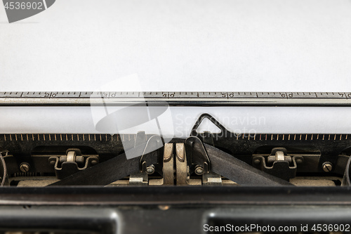 Image of Vintage typewriter with blank sheet of paper retro technology