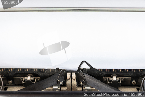 Image of Vintage typewriter with blank sheet of paper retro technology