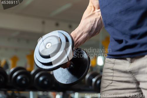 Image of grabbing a dumbbell