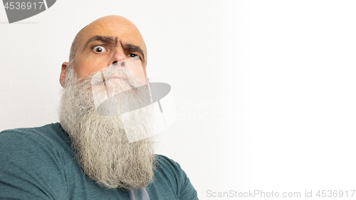 Image of skeptical looking bearded man