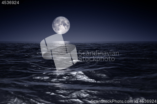 Image of wide ocean waves horizon moon night background