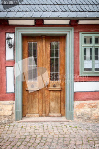 Image of old vintage red wooden door Marburg Germany